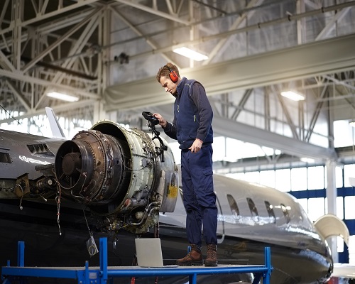 Aircraft mechanic in the hangar